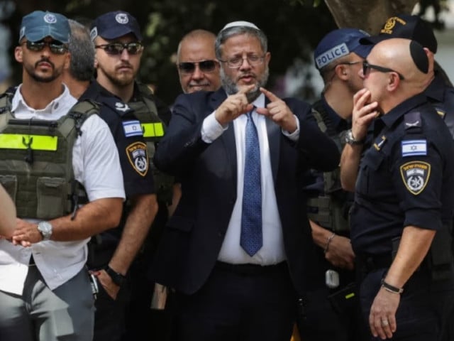 israel s national security minister itamar ben gvir talks to emergency responders at the scene of a suspected stabbing attack in holon israel august 4 2024 photo reuters